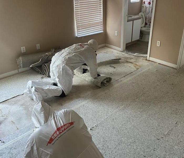 SERVPRO crew member in PPE during a biohazard cleaning job